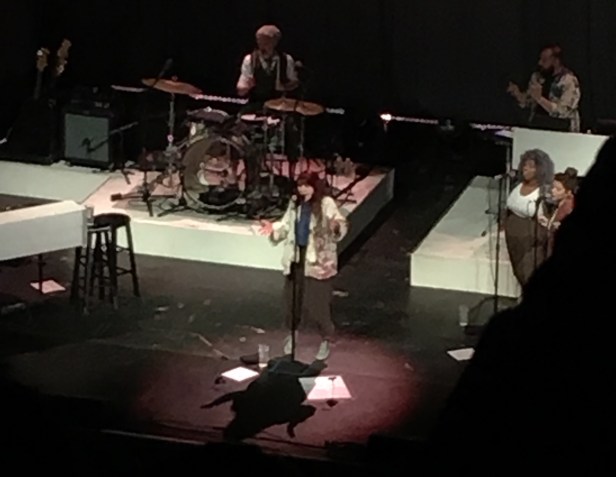 people singing on stage 