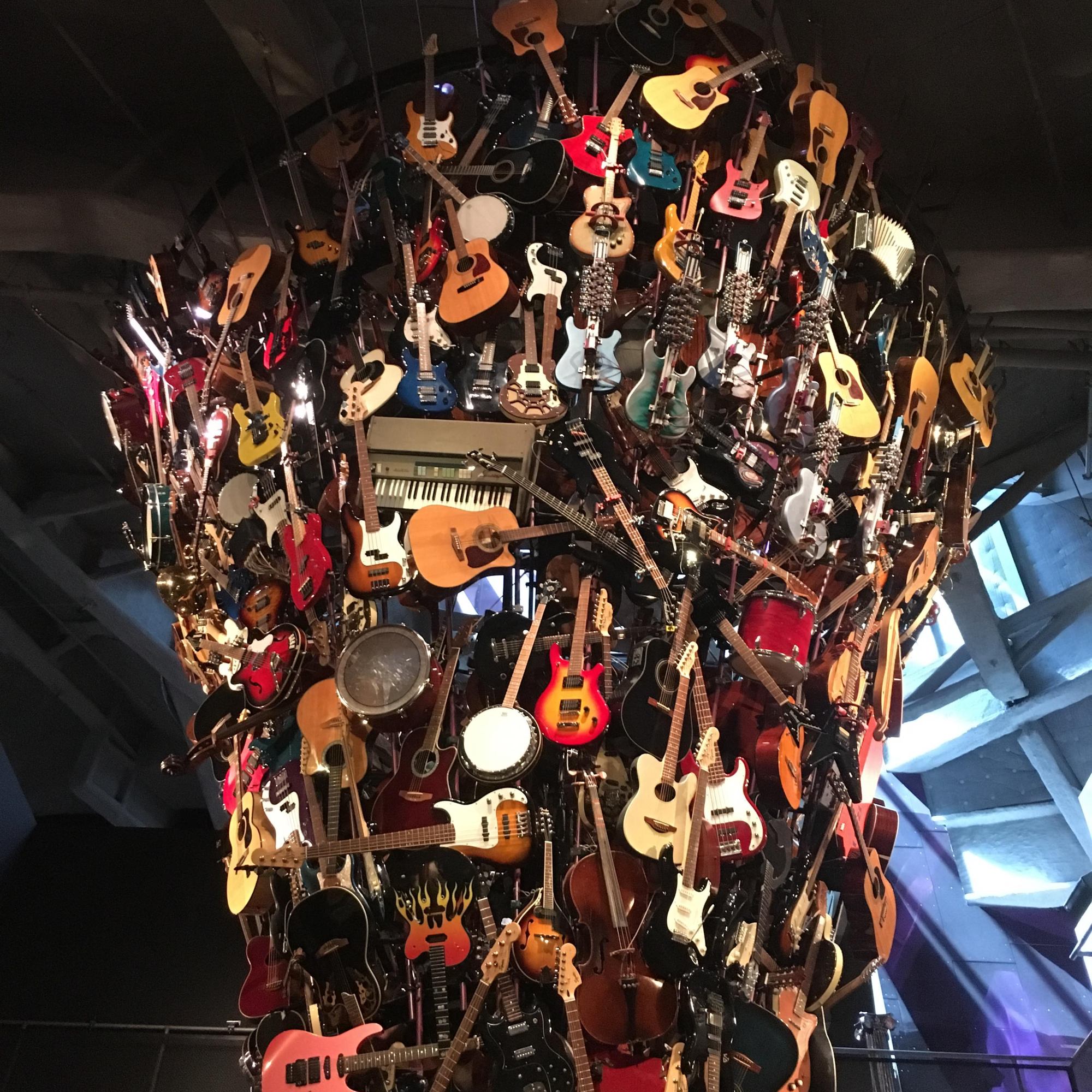 tower of guitar and musical instruments